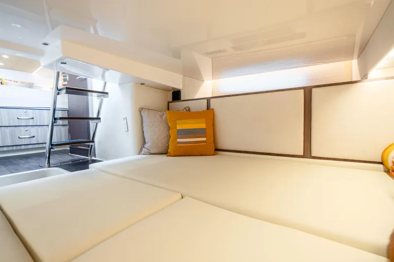 Slide: The Image of Interior cabin of 2022 Regal 36 Grande Coupe with modern design and cozy seating. - 49