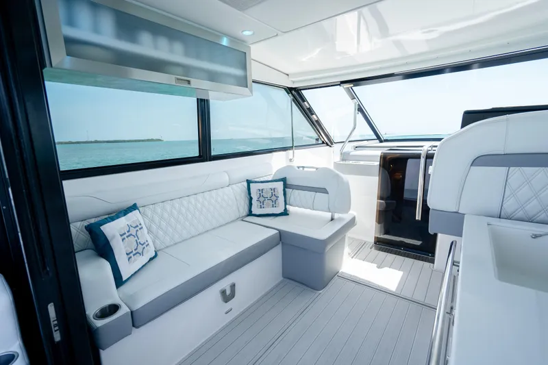 Slide: The Image of Luxurious interior of 2022 Regal 36 Grande Coupe yacht with elegant seating and ocean view. - 28