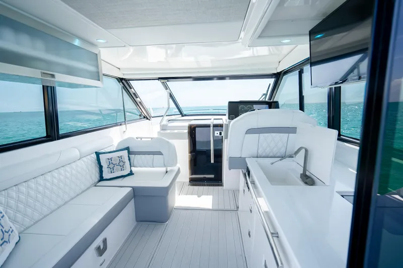 Slide: The Image of Luxurious interior of 2022 Regal 36 Grande Coupe yacht with ocean view. - 29