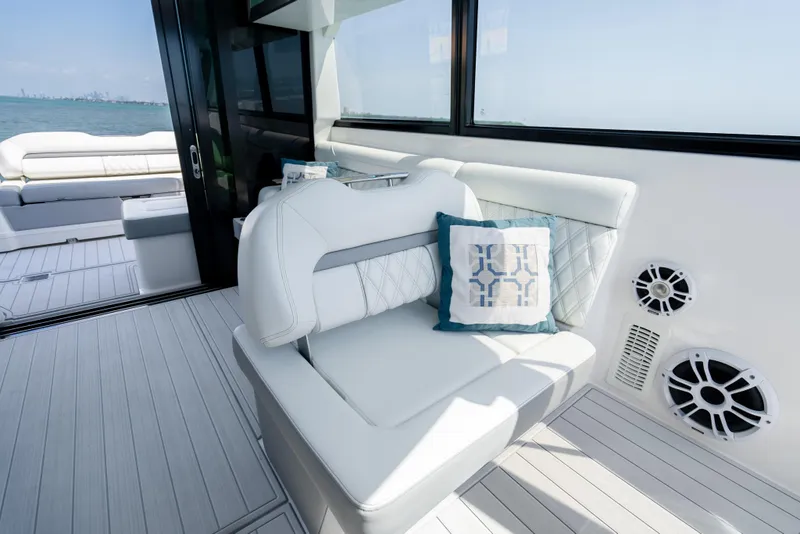 Slide: The Image of Luxurious seating area on 2022 Regal 36 Grande Coupe yacht with ocean view. - 27