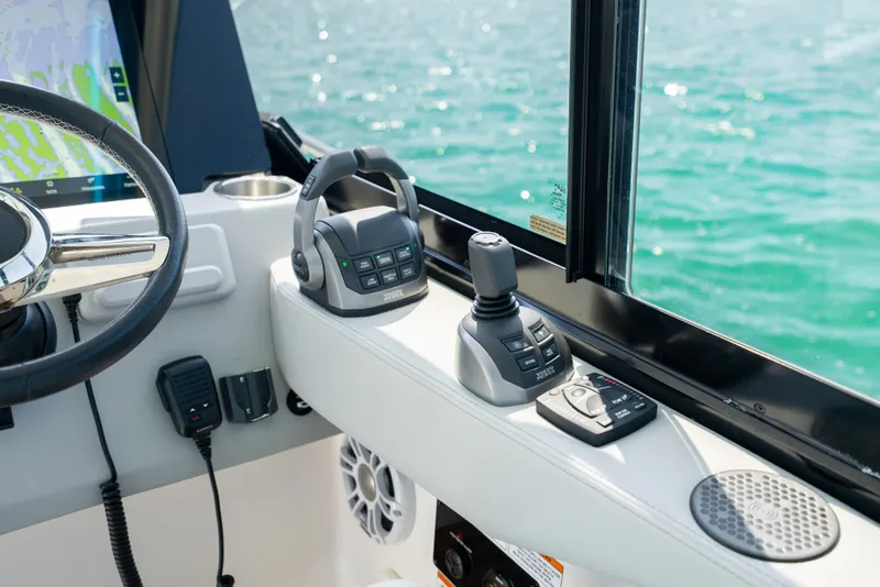 Slide: The Image of Control panel of 2022 Regal 36 Grande Coupe overlooking the ocean. - 37