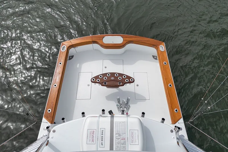 Slide: The Image of Overhead view of 2025 Release Boatworks 46 Express fishing deck on water. - 37