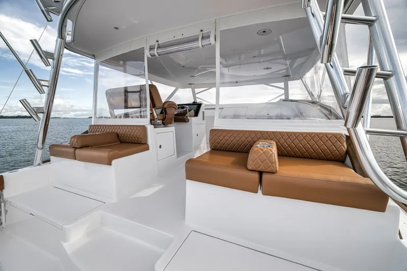 Slide: The Image of Luxurious interior of 2025 Release Boatworks 46 Express with brown leather seating. - 65