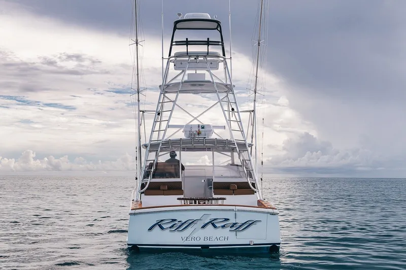Slide: The Image of 2025 Release Boatworks 46 Express yacht on calm ocean waters under cloudy sky. - 14
