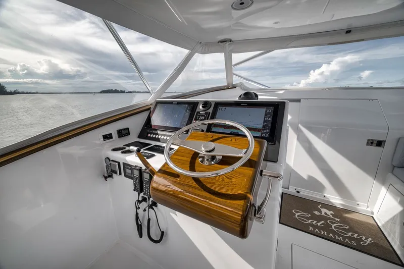 Slide: The Image of Helm of 2025 Release Boatworks 46 Express, featuring modern navigation equipment and sleek design. - 58