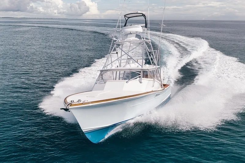 Slide: The Image of 2025 Release Boatworks 46 Express cruising swiftly on open water. - 26