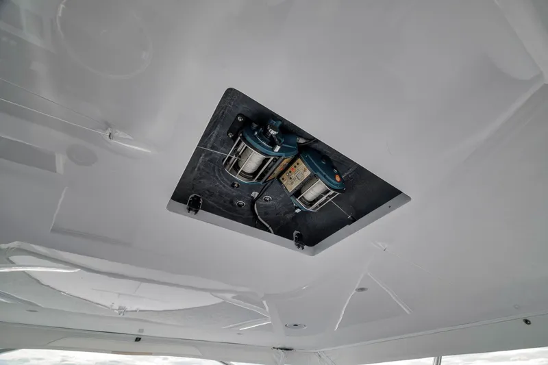 Slide: The Image of Ceiling view of 2025 Release Boatworks 46 Express with mounted equipment. - 64