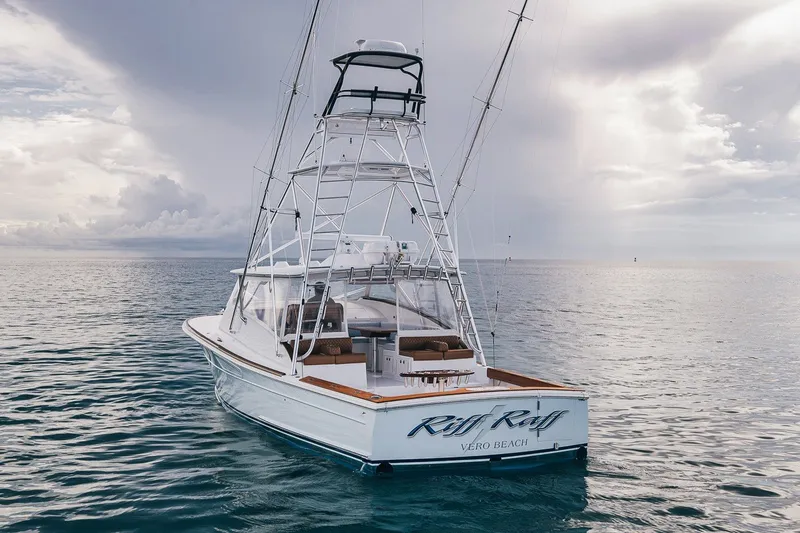 Slide: The Image of 2025 Release Boatworks 46 Express yacht on calm ocean waters under cloudy sky. - 13