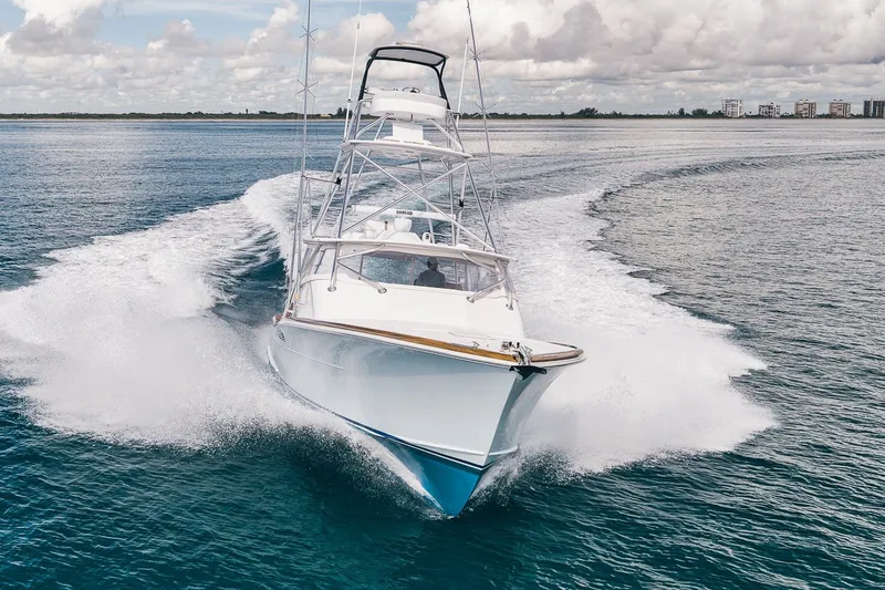 Slide: The Image of 2025 Release Boatworks 46 Express cruising swiftly on open water. - 18