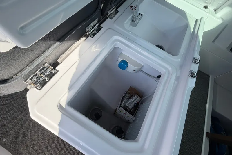 Slide: The Image of Interior storage compartments of 2025 Axopar 29 XC Cross Cabin boat. - 21
