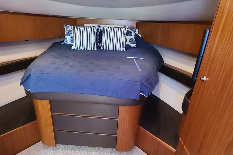 Slide: The Image of Luxurious cabin interior of 2016 Tiara Yachts 3900 Coronet with cozy bedding. - 18