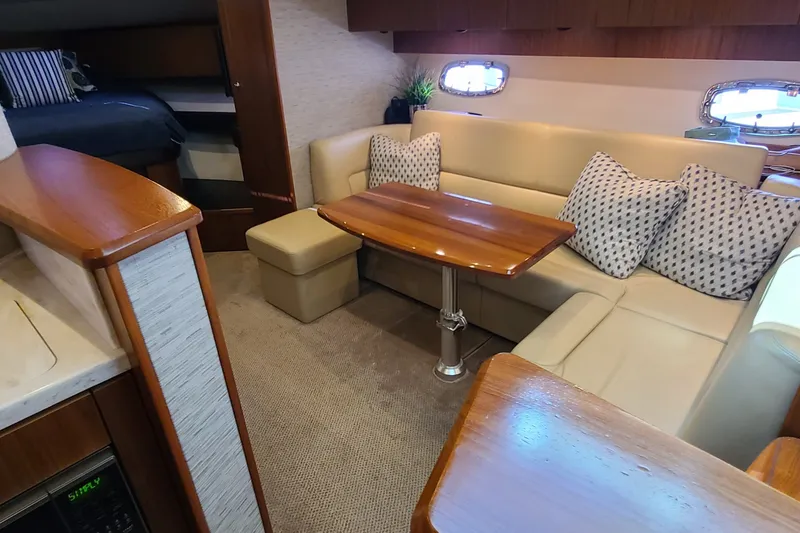 Slide: The Image of Luxurious interior of 2016 Tiara Yachts 3900 Coronet with elegant seating and wooden table. - 20