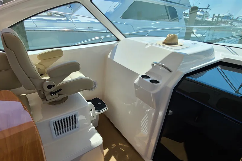 Slide: The Image of Interior of 2016 Tiara Yachts 3900 Coronet with helm seat and dashboard. - 6