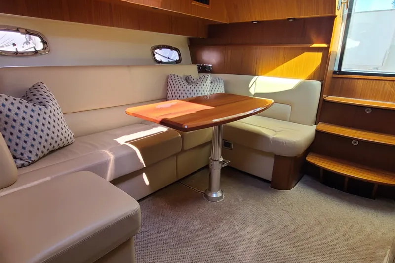 Slide: The Image of Luxurious interior of 2016 Tiara Yachts 3900 Coronet with plush seating and wooden accents. - 16