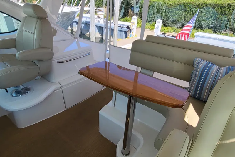 Slide: The Image of Interior of 2016 Tiara Yachts 3900 Coronet with seating and wooden table. - 7