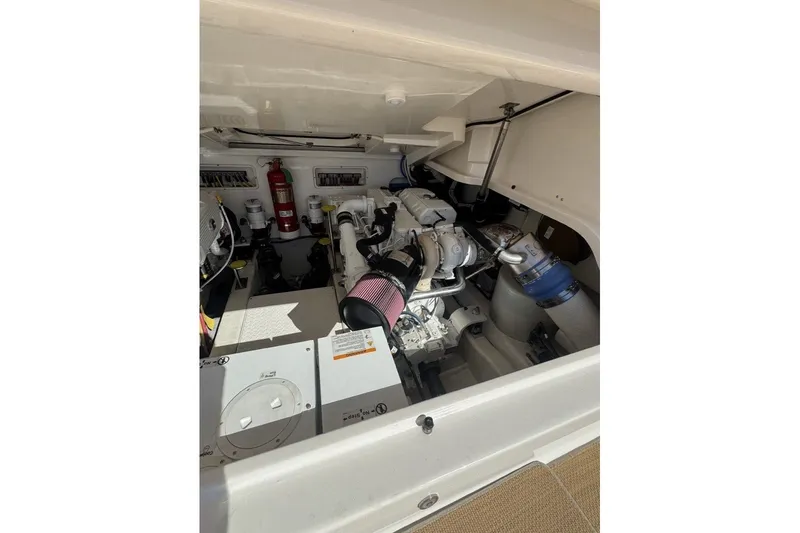 Slide: The Image of Engine compartment of a 2016 Tiara Yachts 3900 Coronet, showcasing mechanical components. - 29