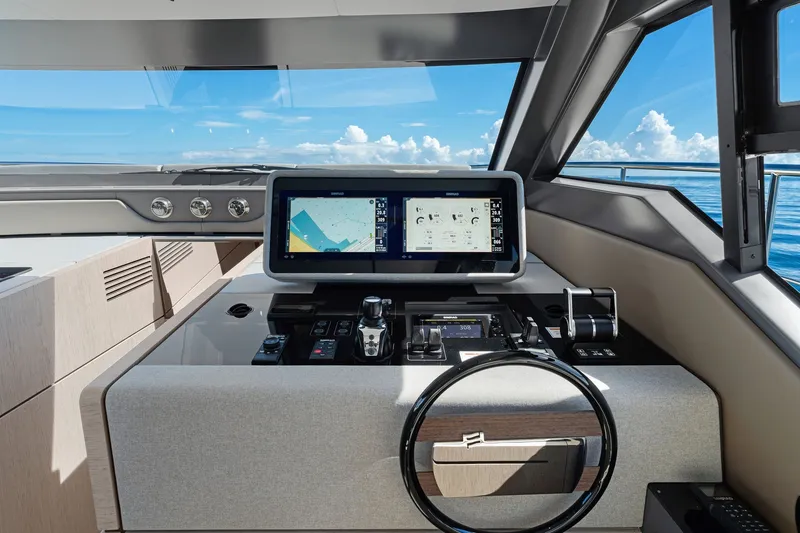 Slide: The Image of Modern helm of 2025 Ferretti Yachts 580 with advanced navigation display and controls. - 34