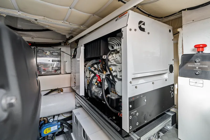 Slide: The Image of Engine room of 2025 Ferretti Yachts 580, featuring a Cummins generator. - 78