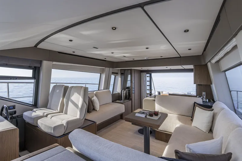 Slide: The Image of Luxurious interior of 2025 Ferretti Yachts 580, featuring elegant seating and panoramic ocean views. - 18