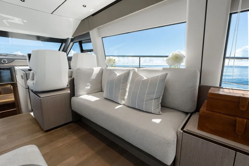 Slide: The Image of Luxurious interior of 2025 Ferretti Yachts 580 with elegant seating and ocean view. - 41
