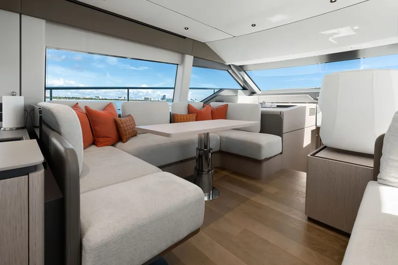 Slide: The Image of Luxurious interior of 2025 Ferretti Yachts 580 with elegant seating and ocean view. - 39