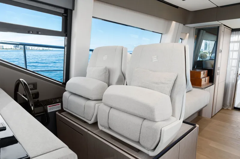 Slide: The Image of Luxurious interior of 2025 Ferretti Yachts 580 with plush seating and ocean view. - 37