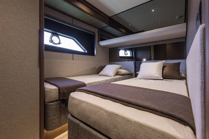 Slide: The Image of Luxurious twin cabin interior of 2025 Ferretti Yachts 580, featuring modern design and comfort. - 40