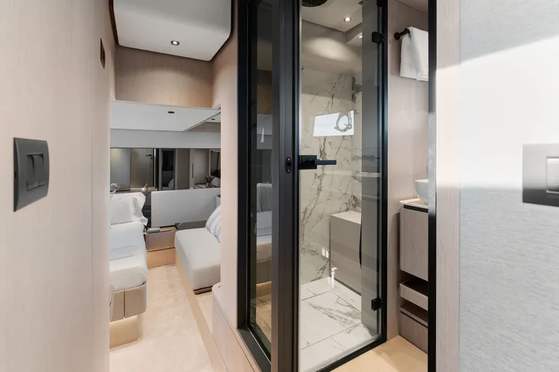 Slide: The Image of Luxurious interior of 2025 Ferretti Yachts 580, featuring modern bathroom and cozy bedroom. - 57