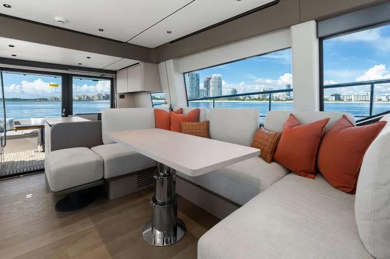 Slide: The Image of Luxurious interior of 2025 Ferretti Yachts 580 with waterfront view and modern seating. - 44