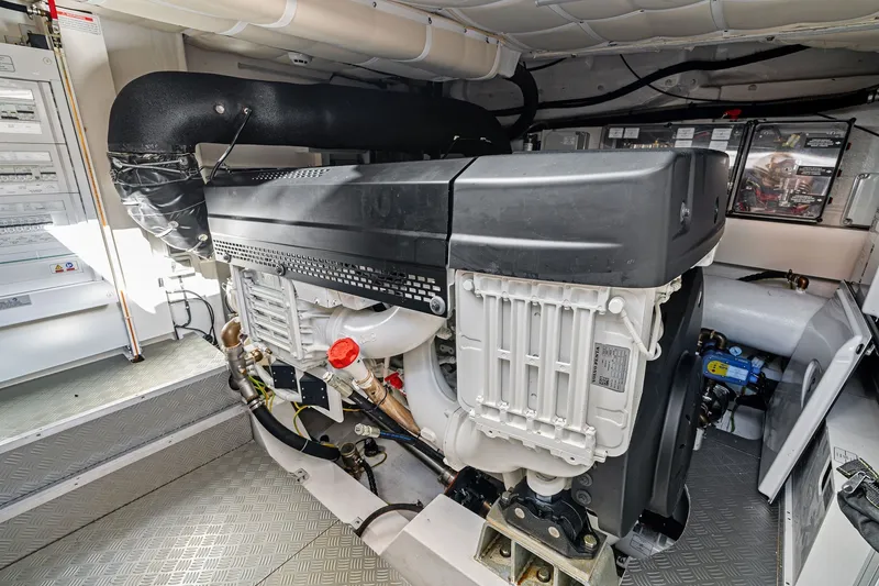 Slide: The Image of Engine room of 2025 Ferretti Yachts 580, showcasing advanced marine engine components. - 76