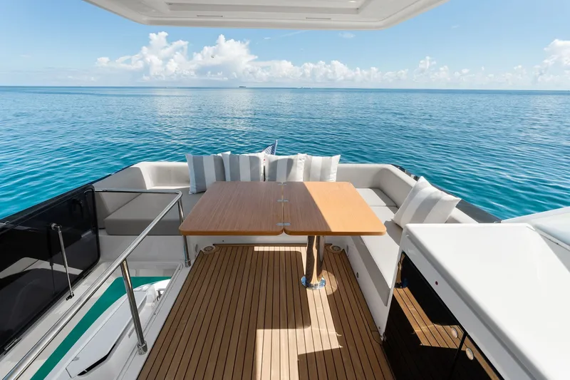 Slide: The Image of Luxurious 2025 Ferretti Yachts 580 deck with elegant seating and ocean view. - 31