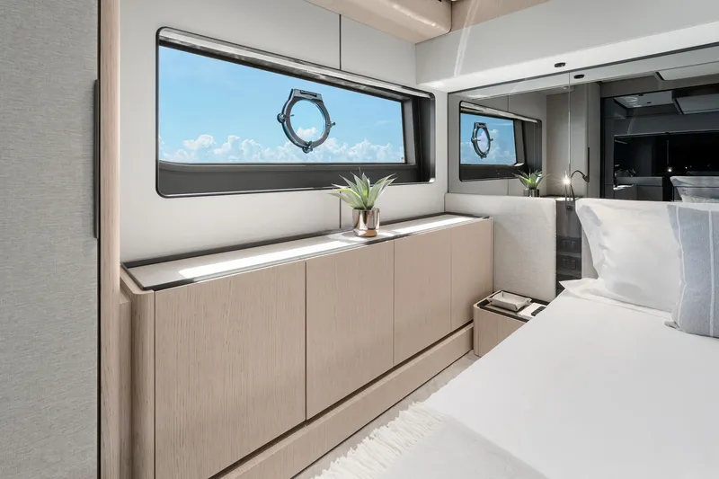 Slide: The Image of Luxurious interior of 2025 Ferretti Yachts 580, featuring elegant bedroom design and ocean view. - 54