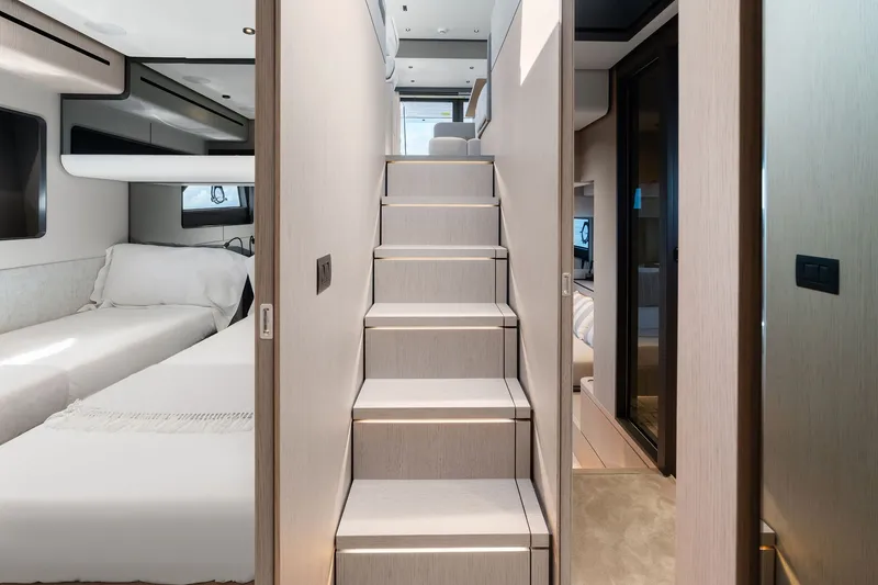 Slide: The Image of Luxurious interior of 2025 Ferretti Yachts 580, featuring modern staircase and elegant cabin design. - 64