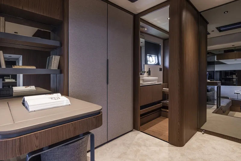 Slide: The Image of Luxurious interior of 2025 Ferretti Yachts 580, featuring elegant wood finishes and modern design. - 32