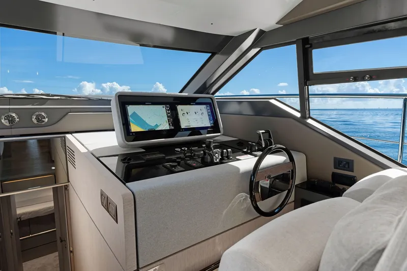 Slide: The Image of Helm of 2025 Ferretti Yachts 580 with modern navigation system and ocean view. - 35