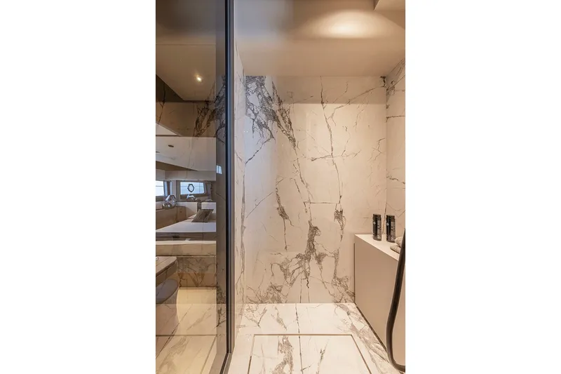 Slide: The Image of Luxurious marble bathroom interior on 2025 Ferretti Yachts 580, featuring elegant design elements. - 37