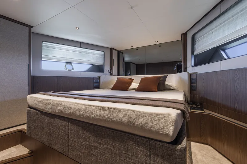 Slide: The Image of Luxurious bedroom interior of 2025 Ferretti Yachts 580 with modern design and elegant furnishings. - 38
