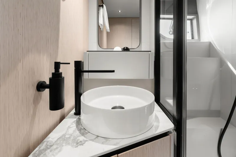 Slide: The Image of Modern bathroom interior on 2025 Ferretti Yachts 580, featuring sleek fixtures and elegant design. - 62