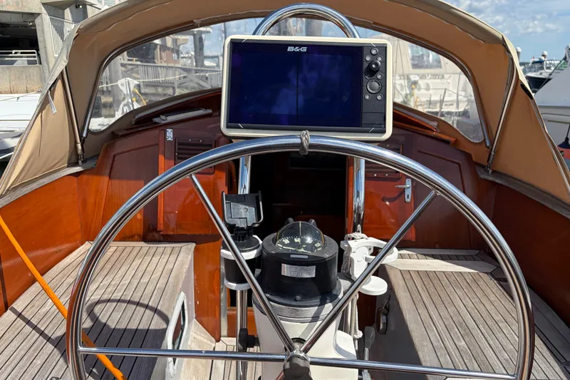 Slide: The Image of Steering wheel and navigation system on a 1987 Vindo 45 sailboat. - 16