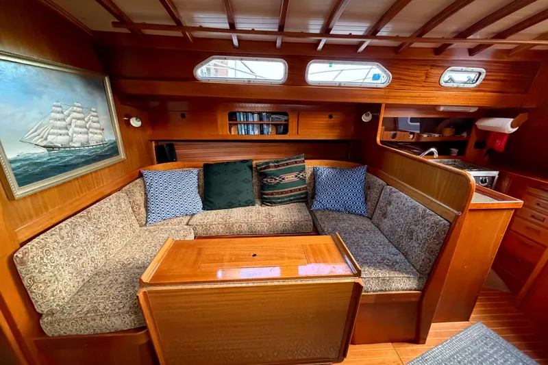Slide: The Image of Cozy interior of 1987 Vindo 45 sailboat with wooden furnishings and nautical decor. - 36