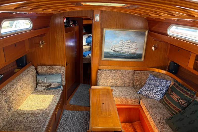 Slide: The Image of Cozy interior of 1987 Vindo 45 sailboat with wooden finish and nautical decor. - 28