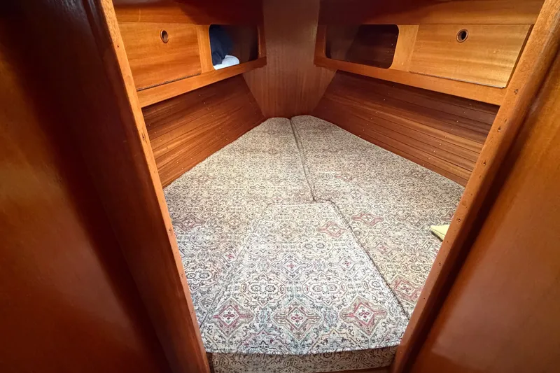 Slide: The Image of Cozy cabin interior of 1987 Vindo 45 sailboat with patterned bedding. - 45