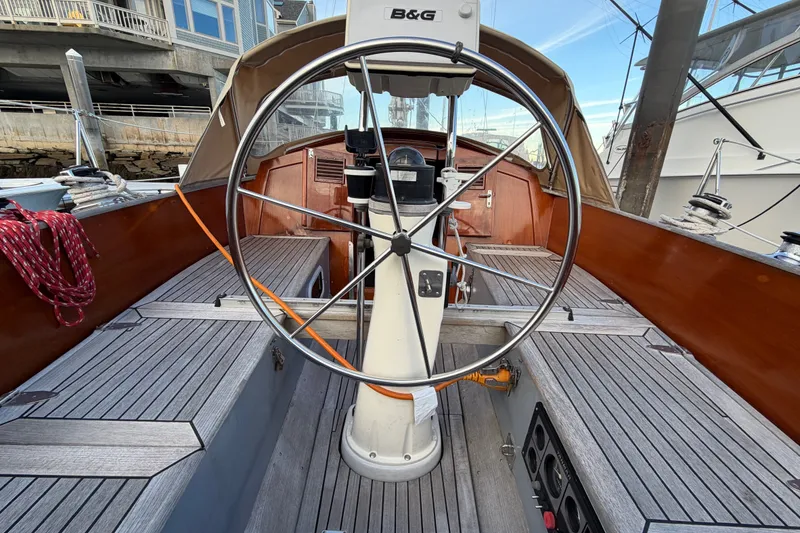 Slide: The Image of Cockpit of 1987 Vindo 45 sailboat with wooden deck and steering wheel. - 24