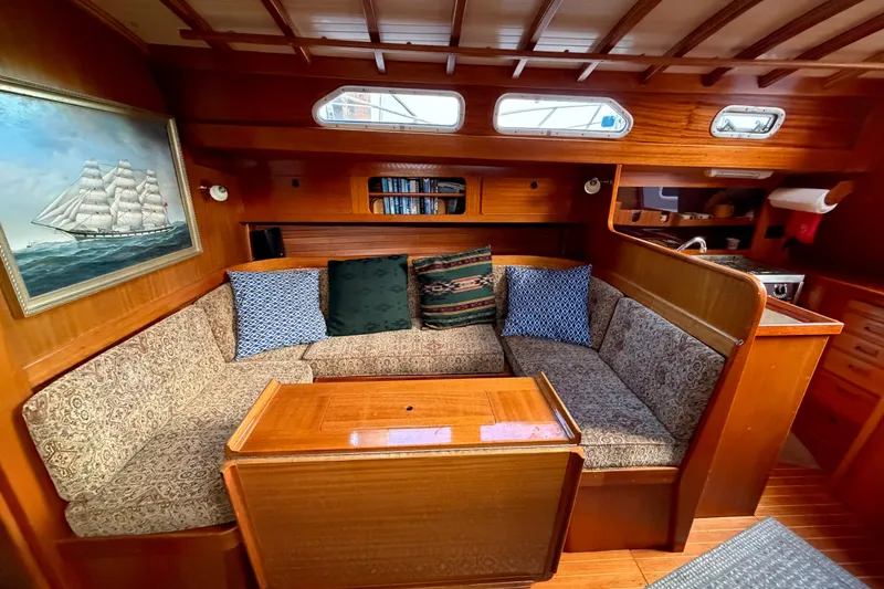 Slide: The Image of Cozy interior of 1987 Vindo 45 sailboat with wooden furnishings and nautical decor. - 37