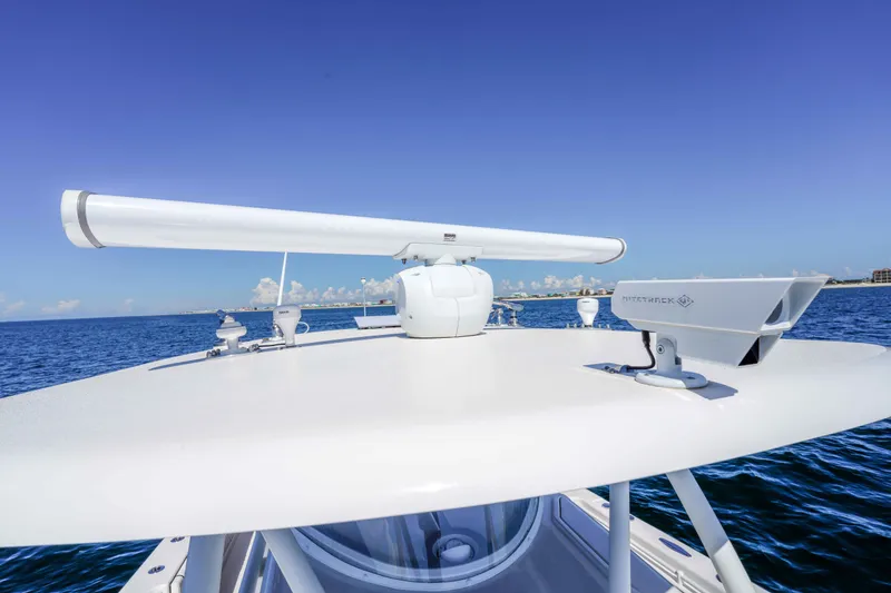Slide: The Image of Rooftop radar and equipment on 2024 Contender 44 CB boat against ocean backdrop. - 10