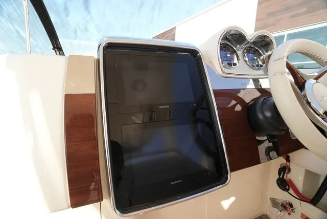 Slide: The Image of The image shows the dashboard of a Chris-Craft Launch 35 GT Sterdrive with modern instruments. - 33