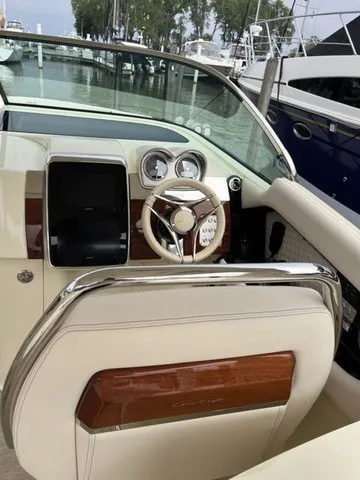 Slide: The Image of The image shows the cockpit of a Chris-Craft Launch 35 GT Sterdrive with a sleek steering wheel. - 10