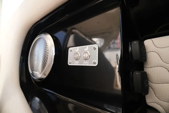 Slide: The Image of Close-up of a speaker and control panel inside a Chris-Craft Launch 35 GT Sterdrive. - 42