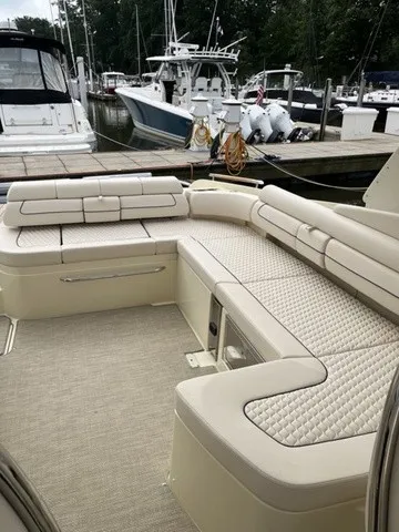 Slide: The Image of The image shows the luxurious cockpit of a Chris-Craft Launch 35 GT Sterdrive with elegant upholstery. - 12