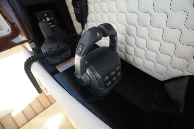 Slide: The Image of Close-up of a Chris-Craft Launch 35 GT Sterdrive control console with a modern joystick. - 36
